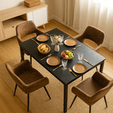 Ensemble table à manger extensible noire avec 4 fauteuils en suédine, style scandinave