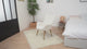 Fauteuil scandinave avec accoudoirs en tissu mouton bouclette beige à surpiqûres - KANAS